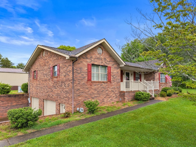 4715/4685 Old Kentucky Rd, Morristown, TN 37814 - view of home's exterior featuring a porch, a lawn, an attached garage, and brick siding