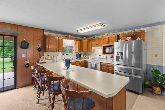 4715/4685 Old Kentucky Rd, Morristown, TN 37814 - kitchen featuring electric stove, stainless steel fridge, wallpapered walls, under cabinet range hood, and light countertops