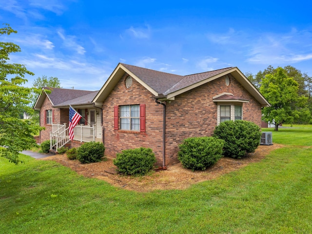 4715/4685 Old Kentucky Rd, Morristown, TN 37814 - view of side of home featuring roof with shingles, brick siding, cooling unit, and a yard