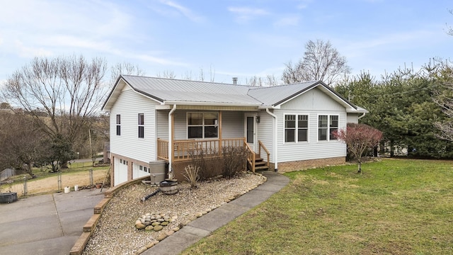 ranch-style home featuring a front lawn, a garage, and a porch