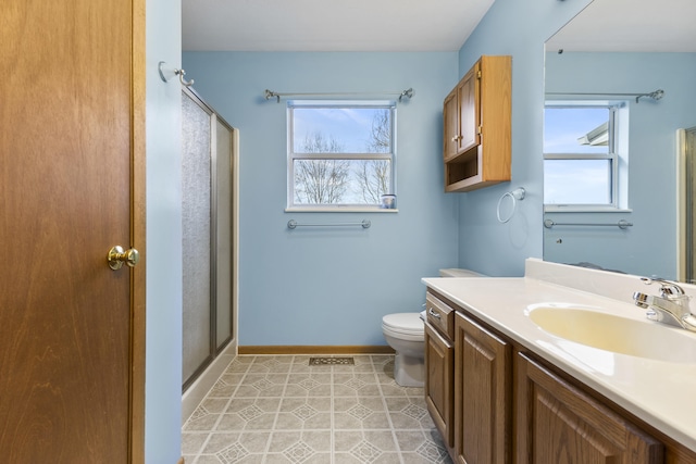 bathroom with walk in shower, vanity, tile patterned flooring, and plenty of natural light