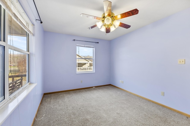 carpeted empty room with ceiling fan