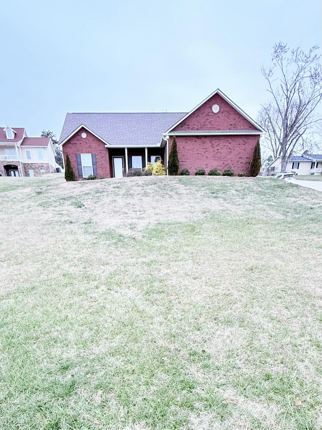 ranch-style house featuring a front lawn