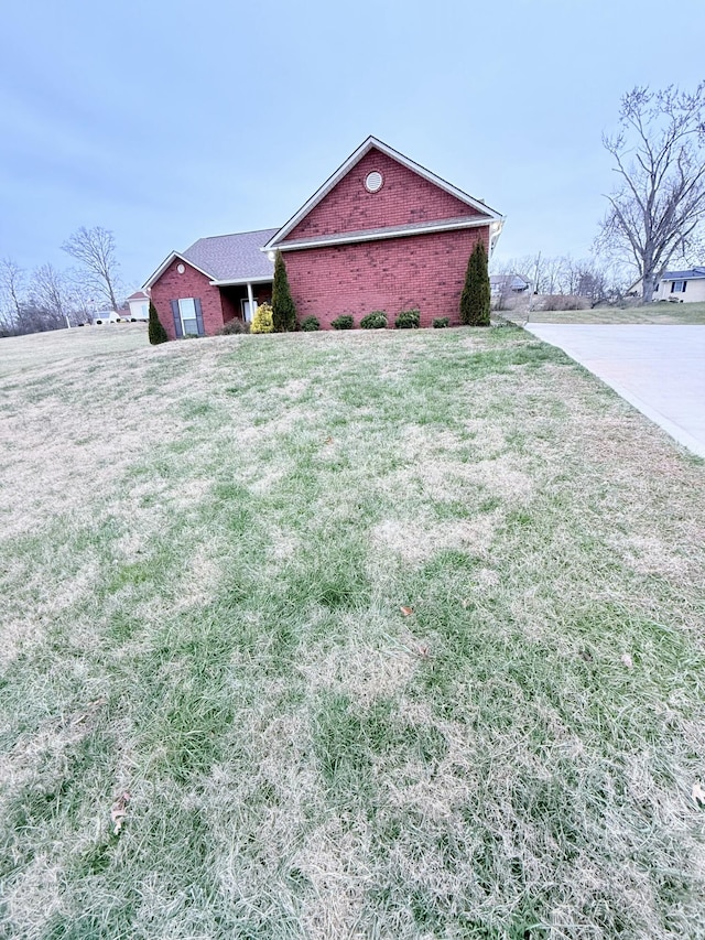 view of property exterior featuring a lawn