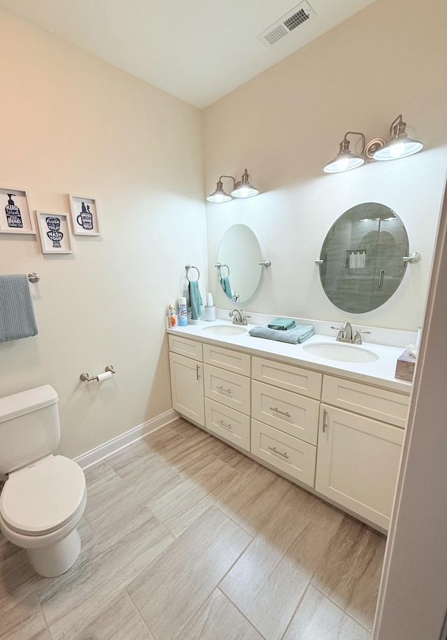 bathroom featuring hardwood / wood-style flooring, vanity, and toilet