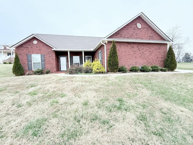 ranch-style house featuring a front yard