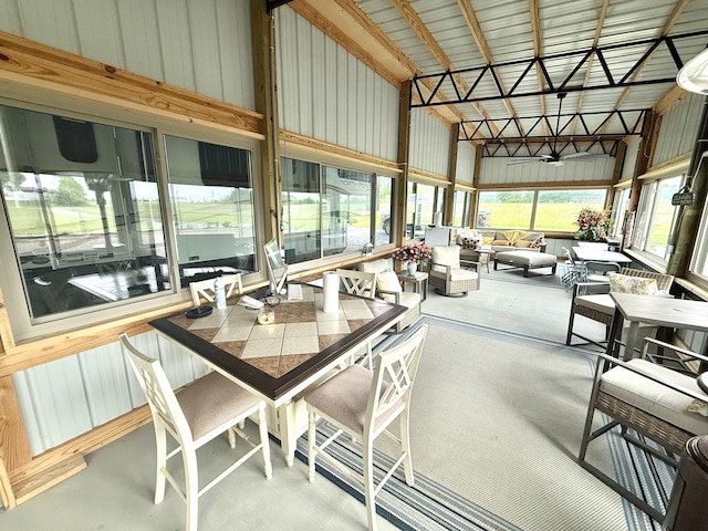 sunroom / solarium with high vaulted ceiling