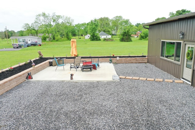 view of patio featuring an outdoor fire pit