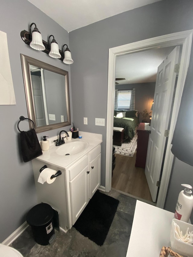 ensuite bathroom featuring connected bathroom and vanity