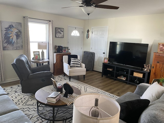 living area with ceiling fan and wood finished floors