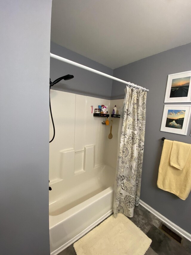 clothes washing area with laundry area, baseboards, and washing machine and clothes dryer