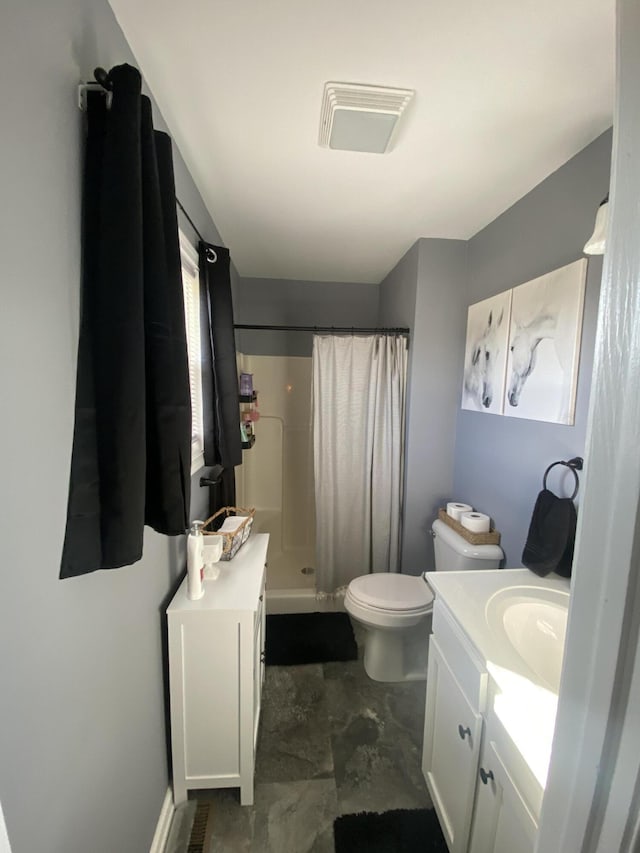 full bath featuring toilet, a shower stall, visible vents, and vanity