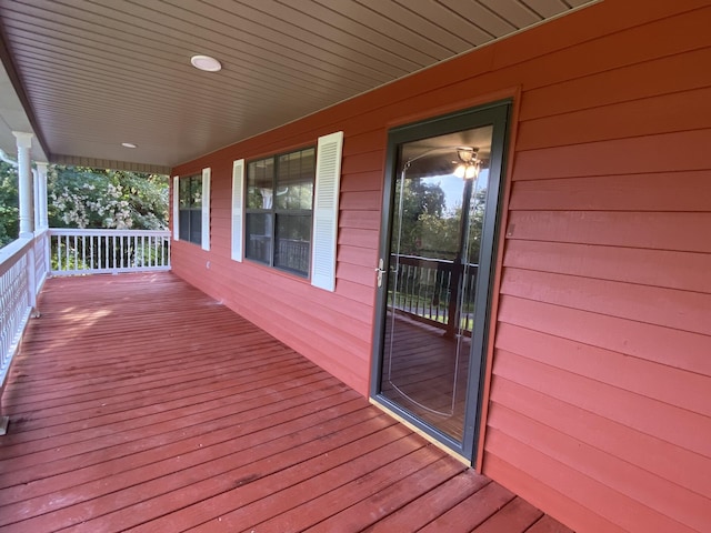 wooden terrace featuring covered porch