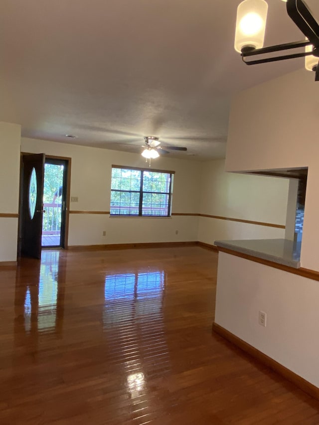 spare room featuring hardwood / wood-style flooring, plenty of natural light, and ceiling fan