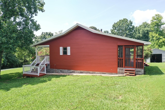 view of side of property with a lawn