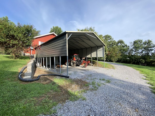 view of parking with a yard and a carport