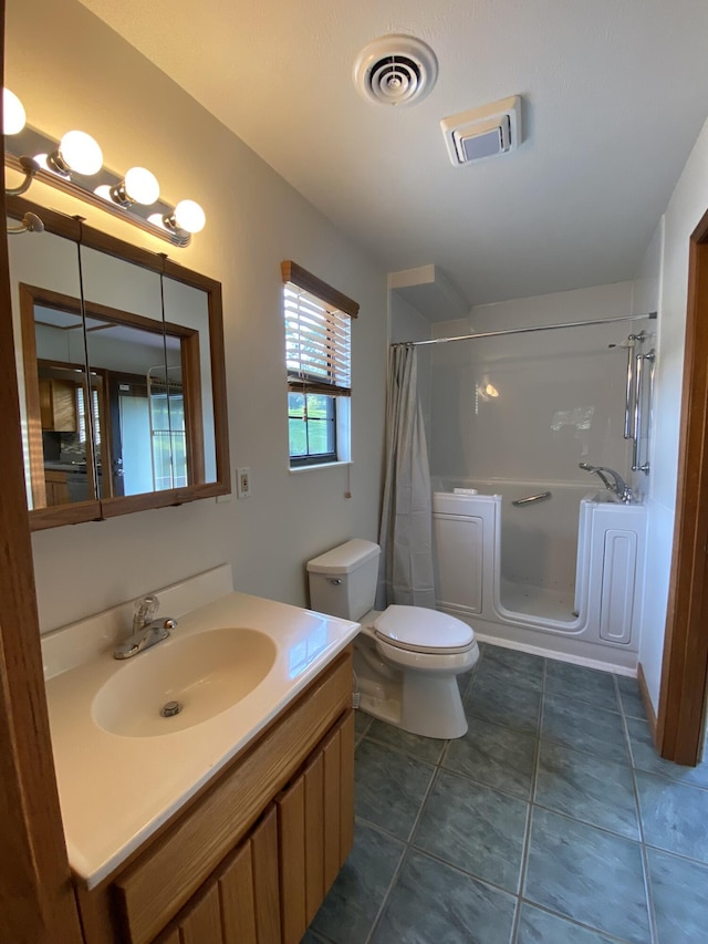 full bathroom featuring tile patterned flooring, shower with separate bathtub, vanity, and toilet