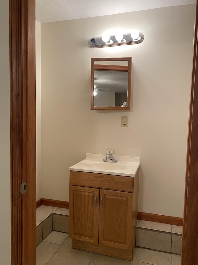 bathroom with tile patterned flooring and vanity