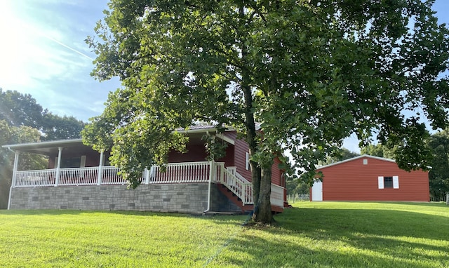 view of property exterior featuring a porch and a yard