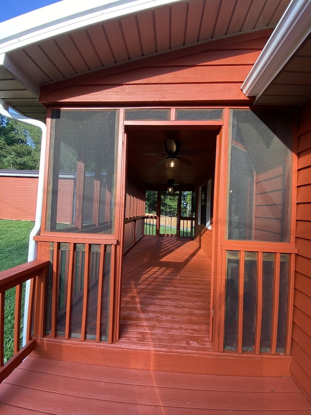 wooden terrace featuring ceiling fan