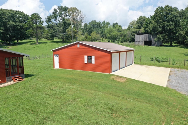 exterior space featuring a lawn and a garage