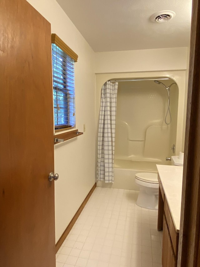 full bathroom featuring shower / bath combination with curtain, vanity, and toilet