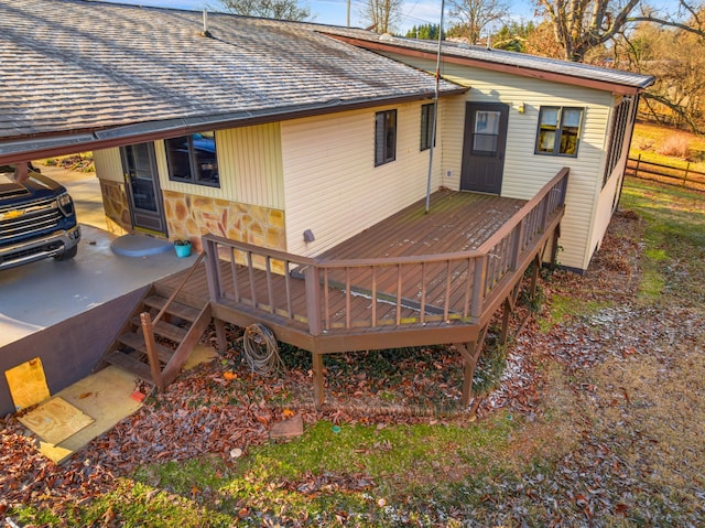 back of property featuring a wooden deck