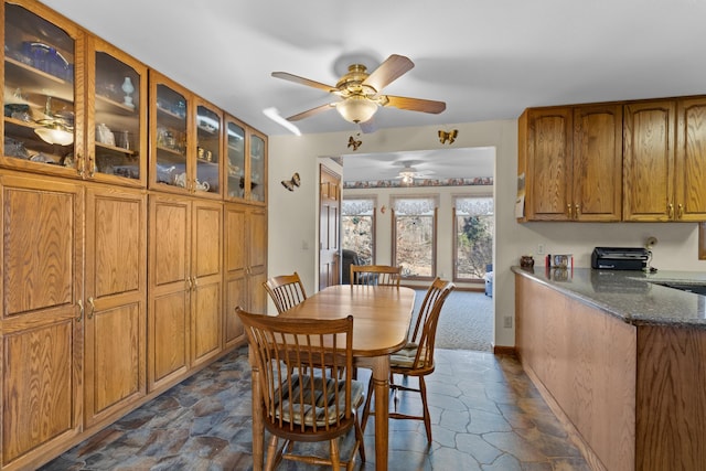 dining room featuring ceiling fan