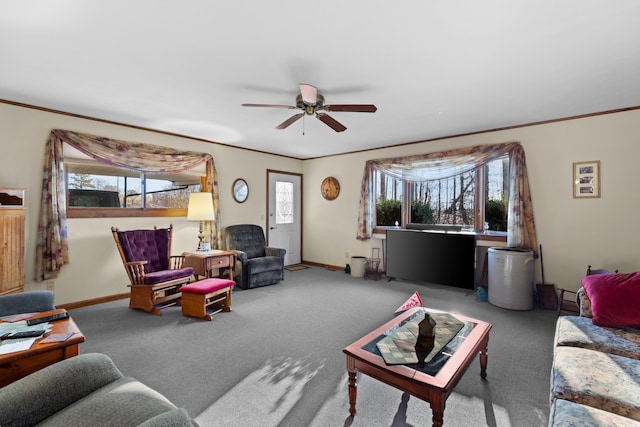 living room with crown molding, plenty of natural light, and carpet floors