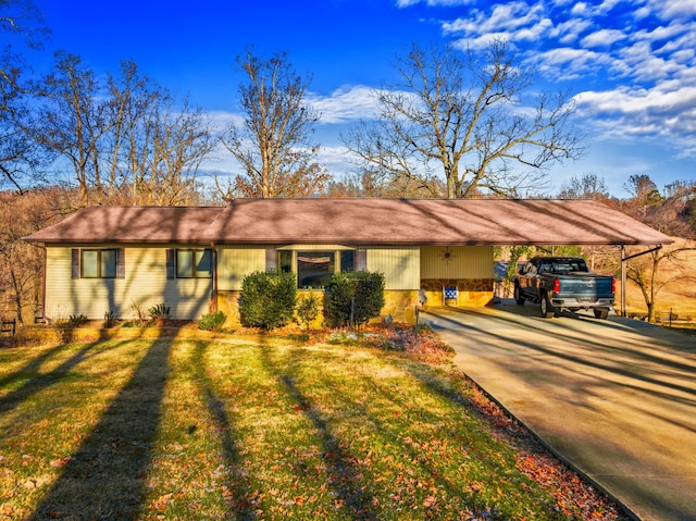 ranch-style home with a front yard and a carport