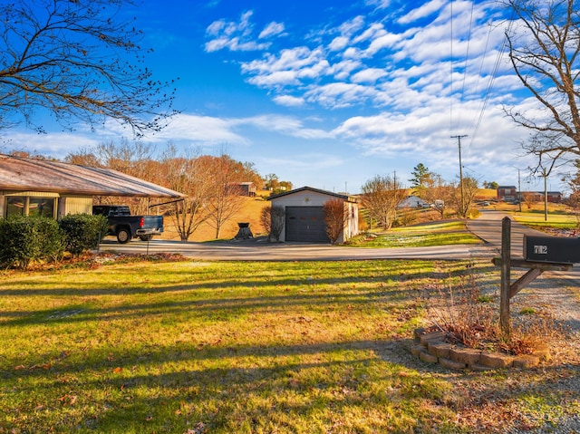 exterior space featuring a garage and an outbuilding