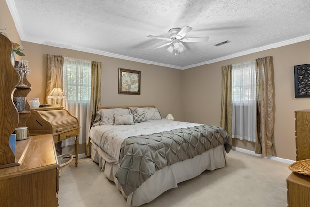 bedroom featuring light carpet, visible vents, a textured ceiling, and ornamental molding