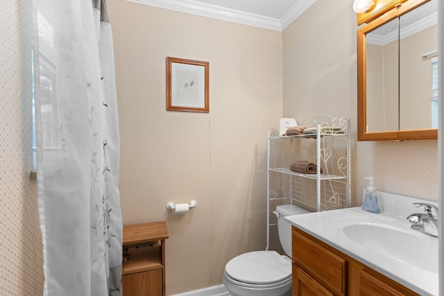 bathroom featuring toilet, ornamental molding, and vanity