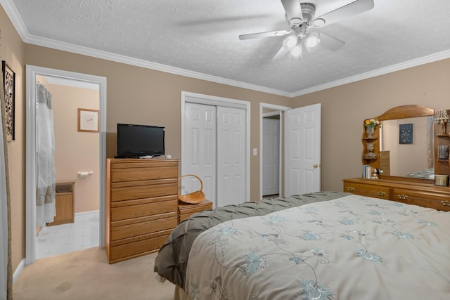 bedroom featuring a textured ceiling, light carpet, a ceiling fan, a closet, and crown molding