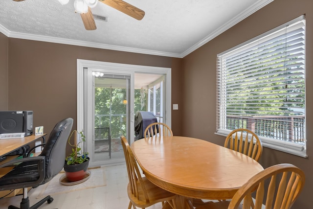 dining space featuring visible vents, a ceiling fan, a textured ceiling, crown molding, and light floors