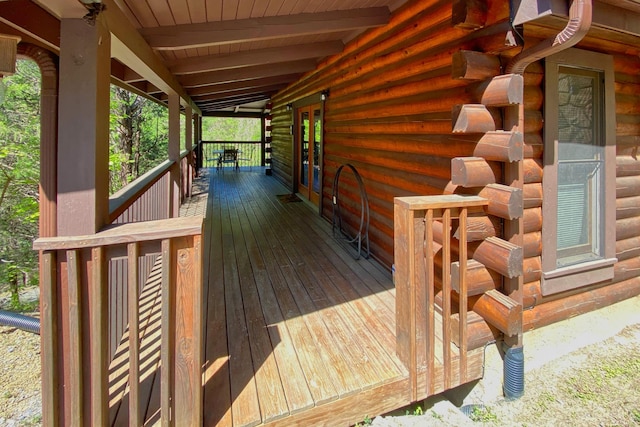 wooden deck featuring covered porch