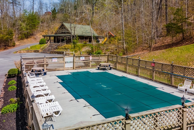 view of swimming pool with a patio area