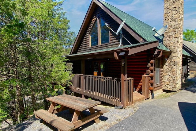 log cabin with a deck