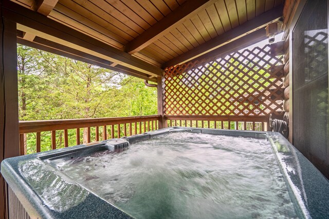 deck featuring a hot tub