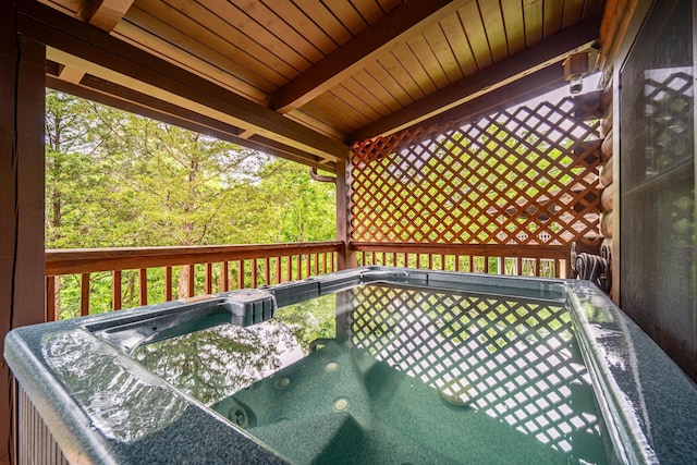 deck featuring a hot tub