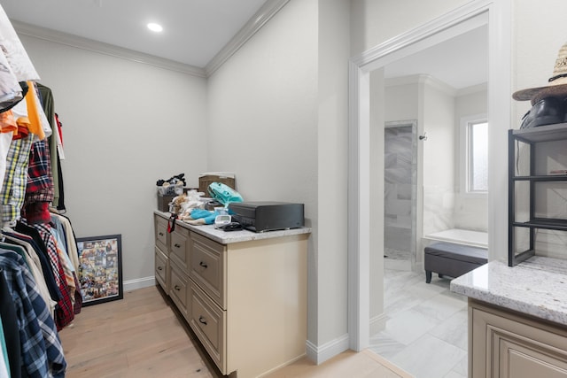 spacious closet featuring light wood-type flooring