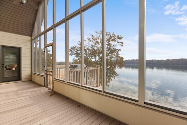 unfurnished sunroom with a water view and a healthy amount of sunlight