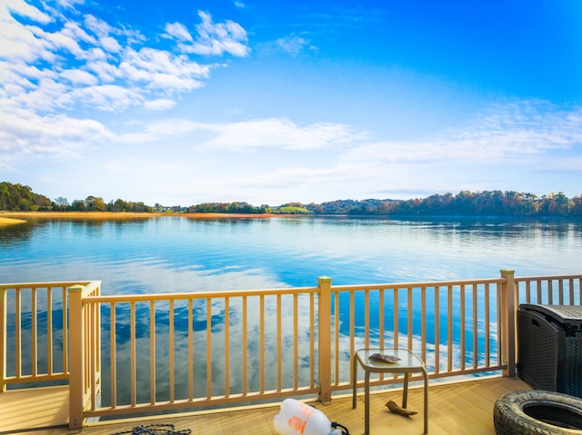 balcony featuring a water view