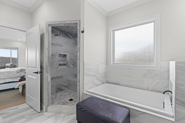 bathroom featuring ornamental molding and independent shower and bath