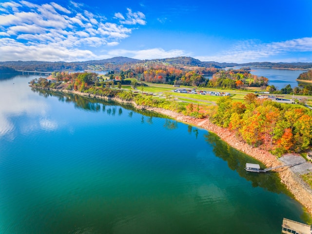 aerial view featuring a water and mountain view