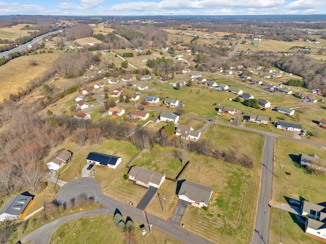 birds eye view of property with a residential view