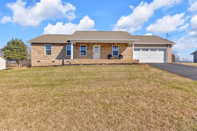 ranch-style house featuring brick siding, an attached garage, a front yard, crawl space, and driveway