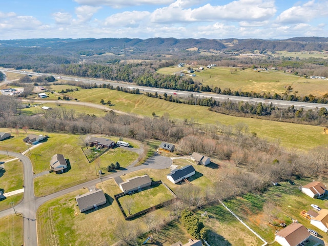 birds eye view of property with a rural view and a mountain view