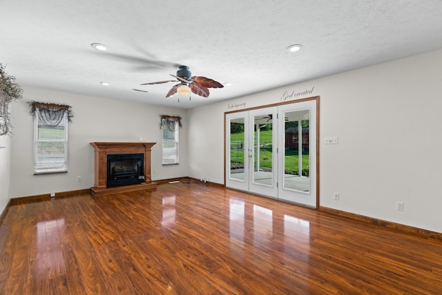 2757 Bethel Rd, Morristown, TN 37813 - unfurnished living room featuring wood finished floors, ceiling fan, recessed lighting, a fireplace with raised hearth, and baseboards
