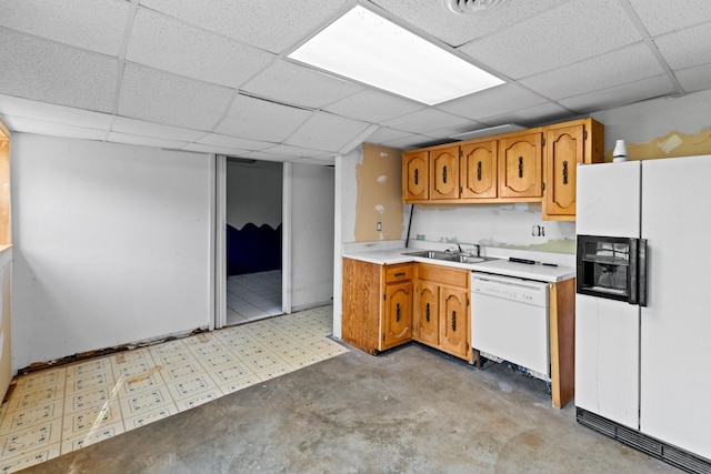 2757 Bethel Rd, Morristown, TN 37813 - kitchen featuring white appliances, a paneled ceiling, brown cabinetry, light countertops, and a sink